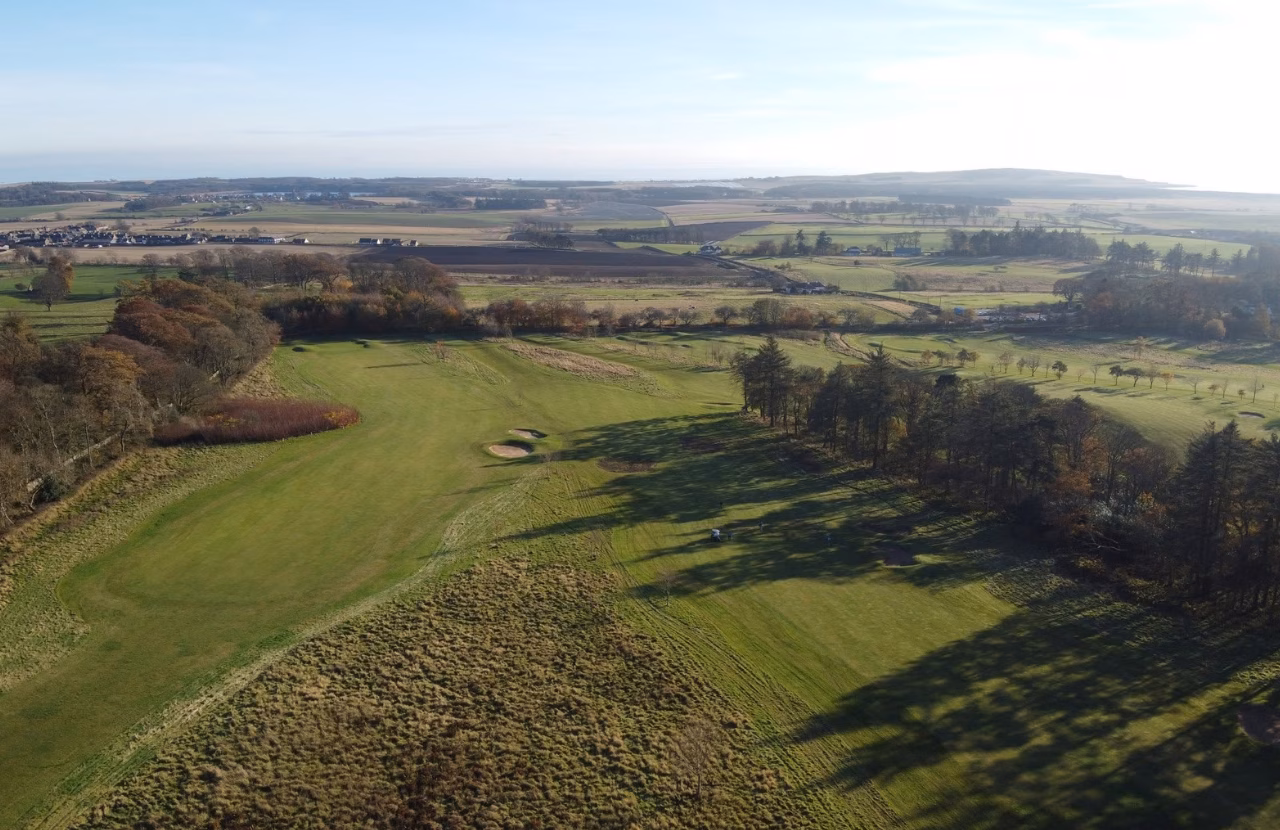 Charleton Golf Club across rolling parkland with farmland and the Fife coast beyond.