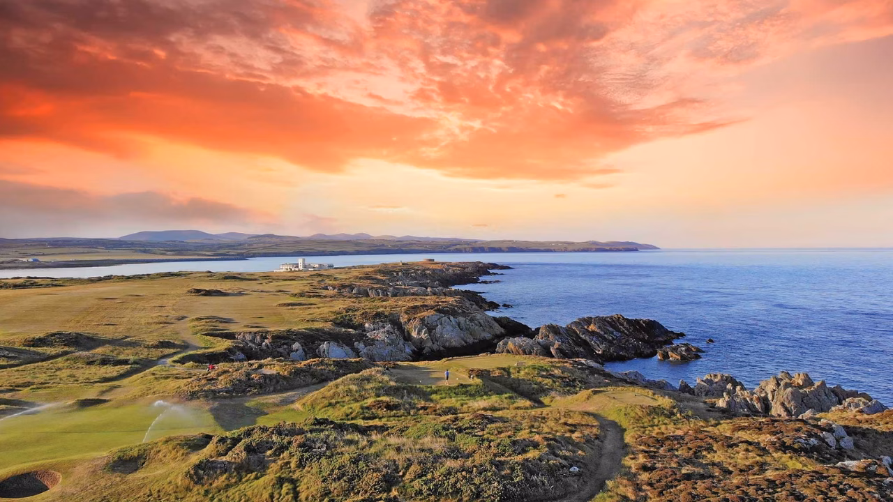 Castletown Golf Links beside the sea on the Isle of Man at sunset.
