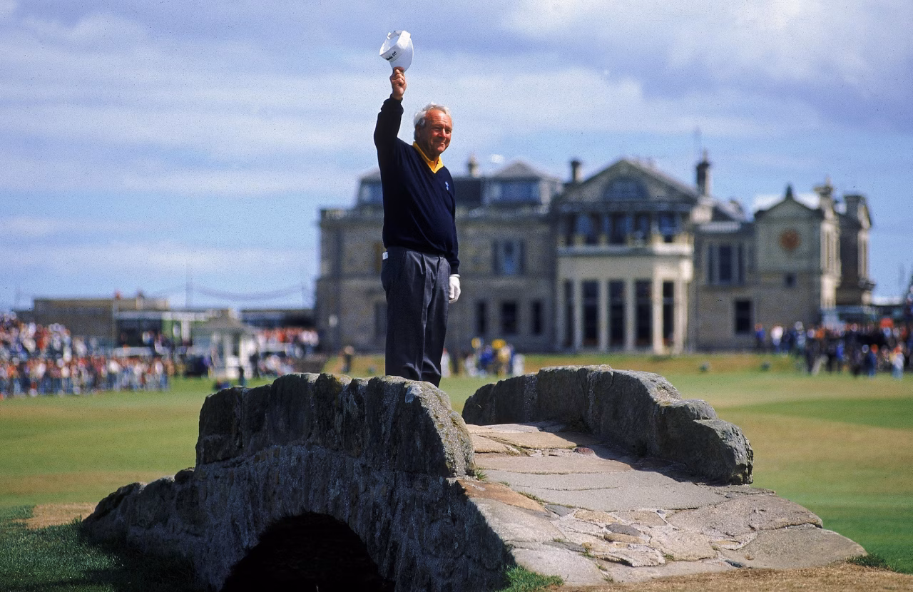 Arnold Palmer waving from the Swilcan Bridge during his 1995 farewell at St Andrews.