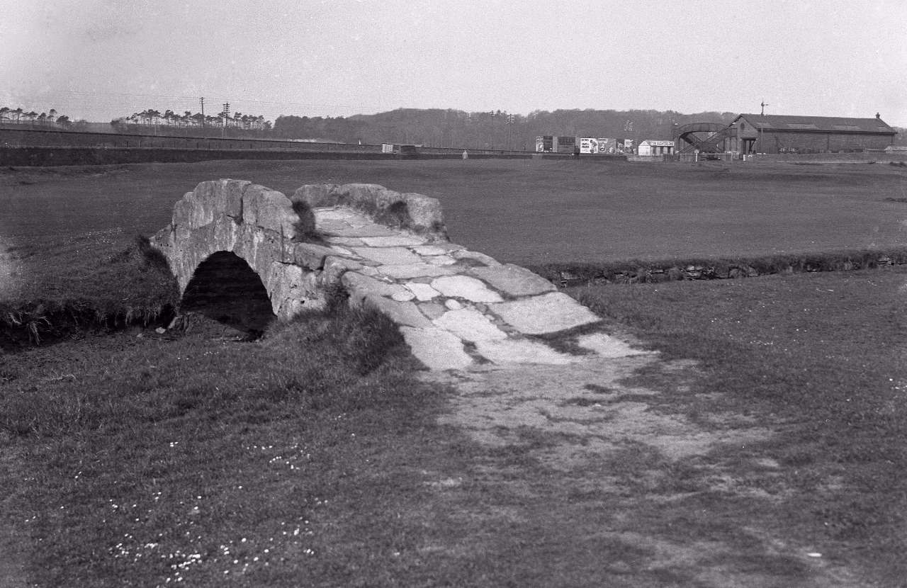 Historic black-and-white view of the Swilcan Bridge on the Old Course around 1945.