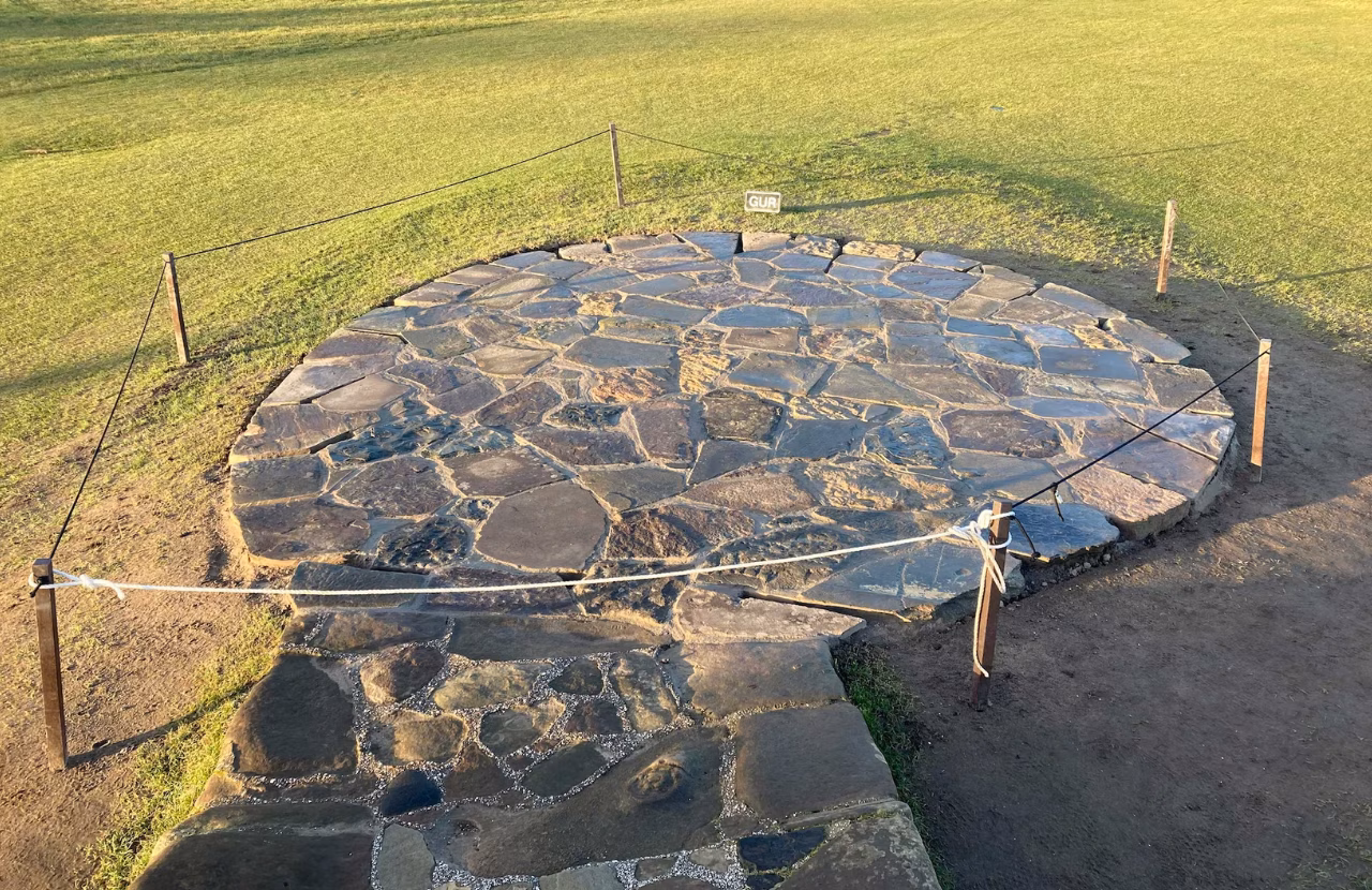 Temporary stone paving installed around the Swilcan Bridge approach in 2023.