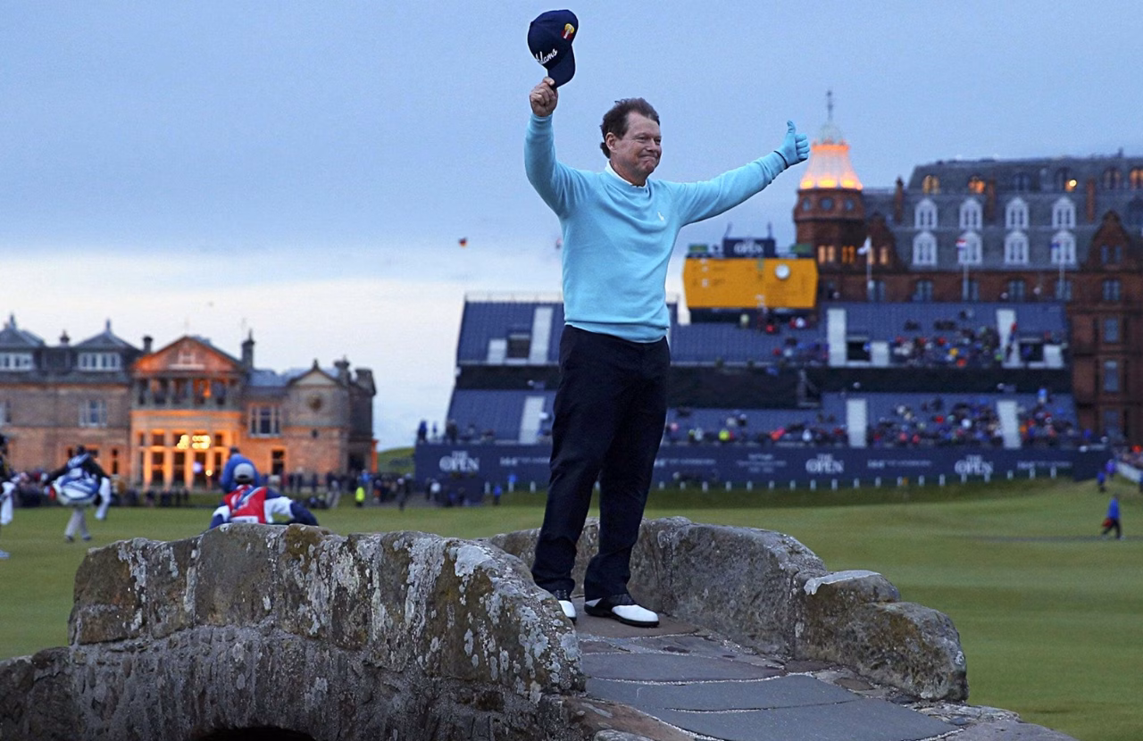 Tom Watson waving from the Swilcan Bridge during his final Open appearance in 2015.
